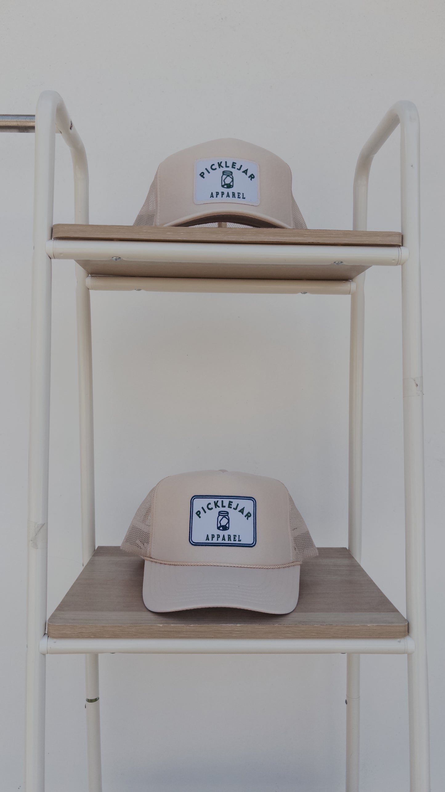 CREAM FOAM TRUCKER HAT WITH EMBROIDERED PATCH